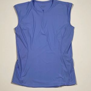Athleta fitness top with breathable side panels and essentials pocket